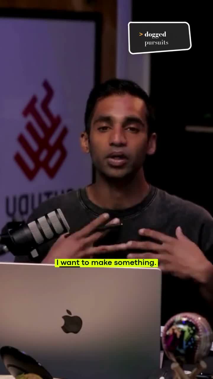 A low-resolution vertical frame of Jai speaking into a microphone behind a laptop. The subtitle reads: I want to make something.